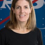 This is an official photograph of Angela Bowes, Business Development Manager of the Aeronautics Research Directorate at NASA’s Langley Research Center. Bowes is wearing a black shirt and standing in front of the NASA logo.