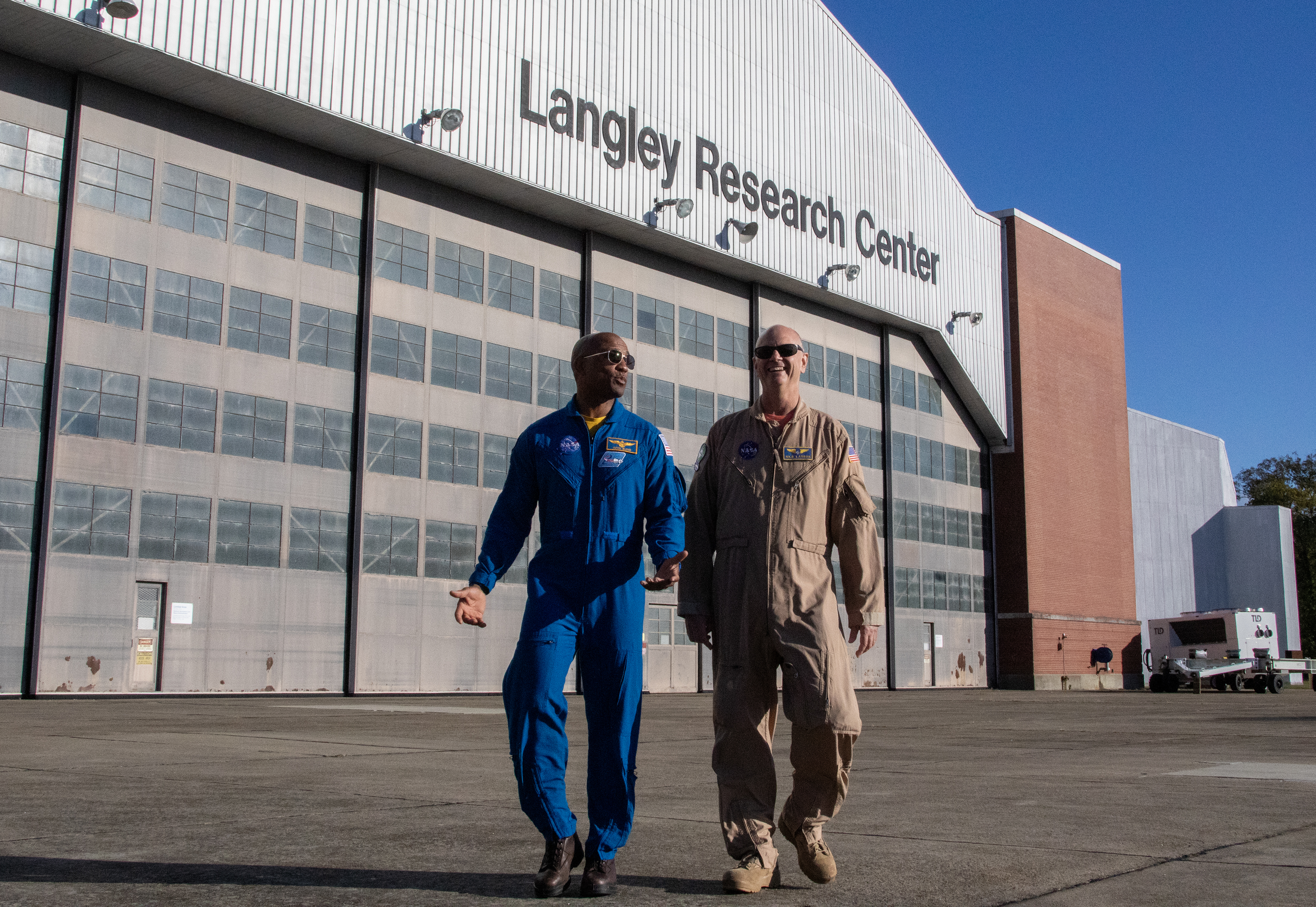 Nils Larson, X59 pilot and Astronaut Victor Glover walking side-by-side.