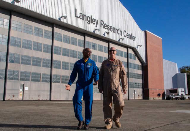 Nils Larson, X59 pilot and Astronaut Victor Glover walking side-by-side.