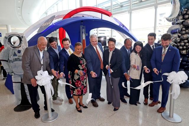 From left, New Orleans Airport Director Kevin Dolliole, New Orleans Director of Economic Development Jeff Schwartz, Space Launch System Stages Element Office Resident Management Office Manager Gregg Eldridge, Congressman Carter’s District Director Demetric Mercadel, Michoud Director Lonnie Dutreix, New Orleans Mayor LaToya Cantrell, Judge Michael Bagneris, New Orleans & Co. Executive Vice-President Alice Glenn, New Orleans Business Alliance Interim President Louis David, and GNO Inc. Senior Vice-President of Business Development Josh Fleig cut the ribbon at the NASA educational display ribbon-cutting ceremony at Louis Armstrong International Airport in New Orleans.