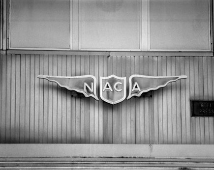 The logo for the National Advisory Committee for Aeronautics (NACA) on the wall of the 8-foot transonic pressure wind tunnel at the Langley Aeronautical Laboratory