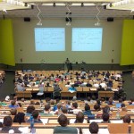 people auditorium meeting sitting students education