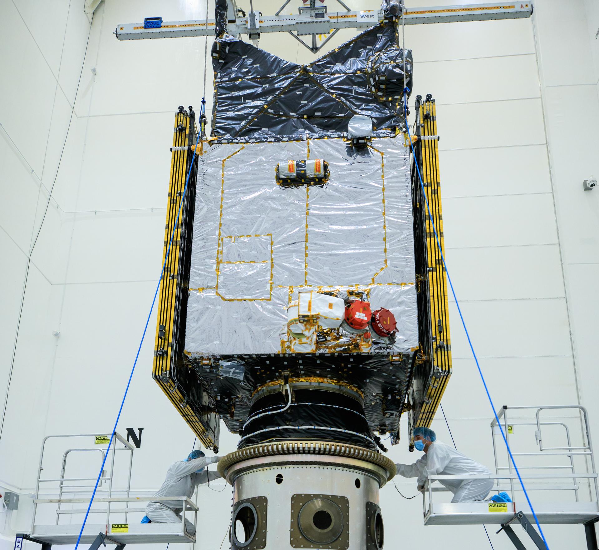 Technicians connected NASA’s Psyche spacecraft to the payload attach fitting inside the clean room at Astrotech Space Operations facility in Titusville, Florida on Wednesday, Sept. 20, 2023.