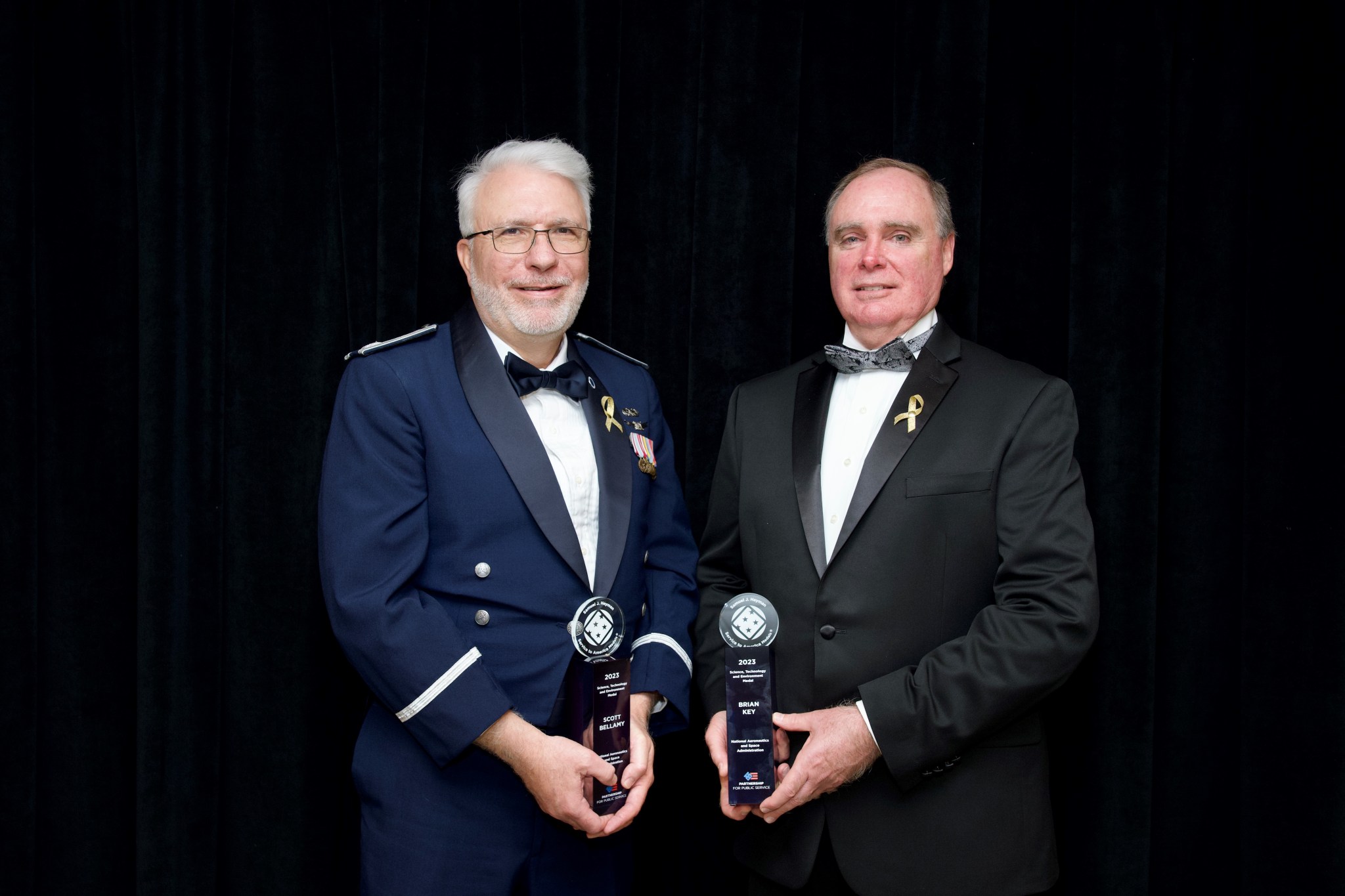 Scott Bellamy, left, and Brian Key, right, stop for a photo moments after receiving the Samuel J. Heyman Service to America Medals. Bellamy and Key accepted on behalf of the entire DART team during a ceremony at the John F. Kennedy Center for Performing Arts in Washington on Oct. 17.