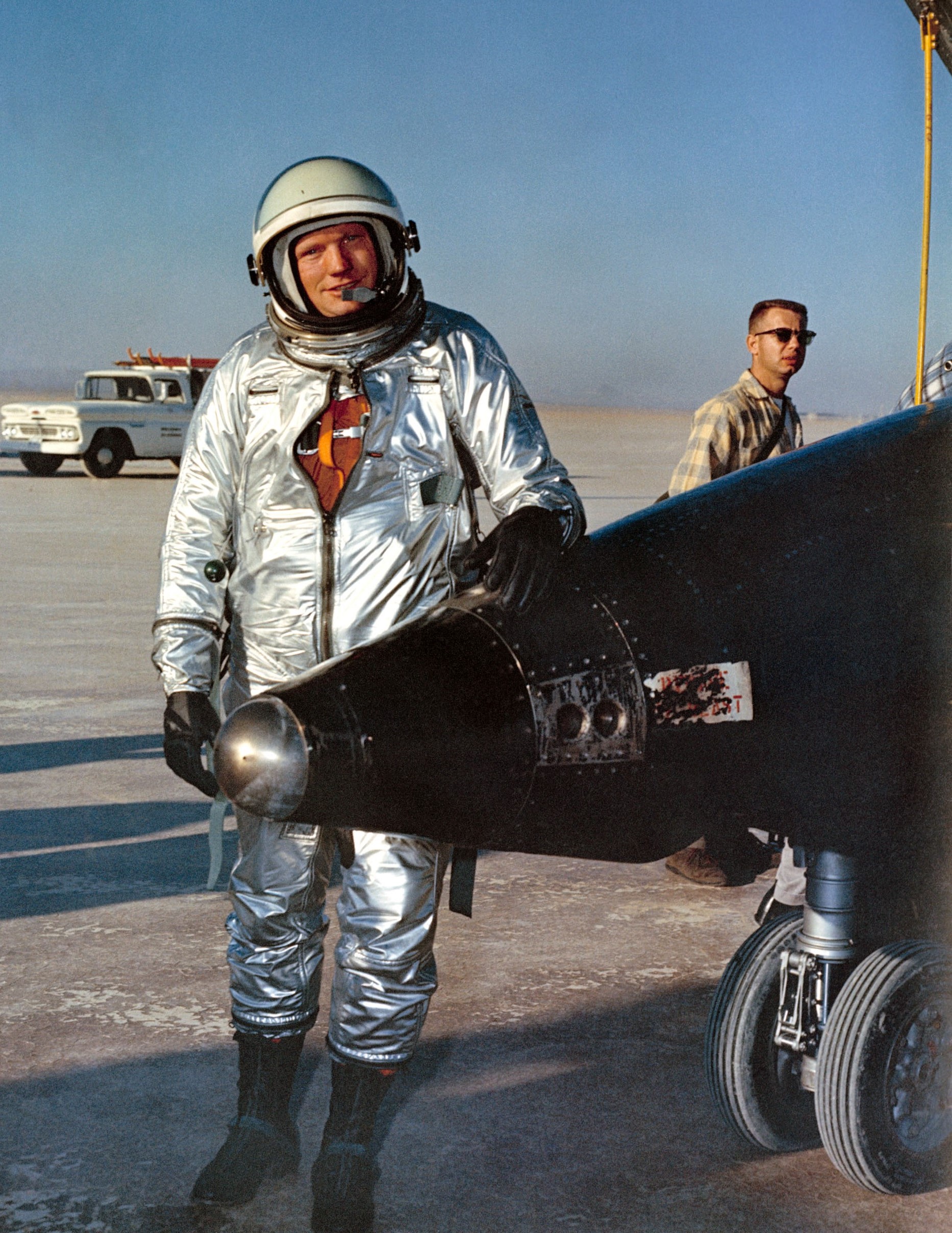 NASA pilot Neil A. Armstrong stands next to an X-15