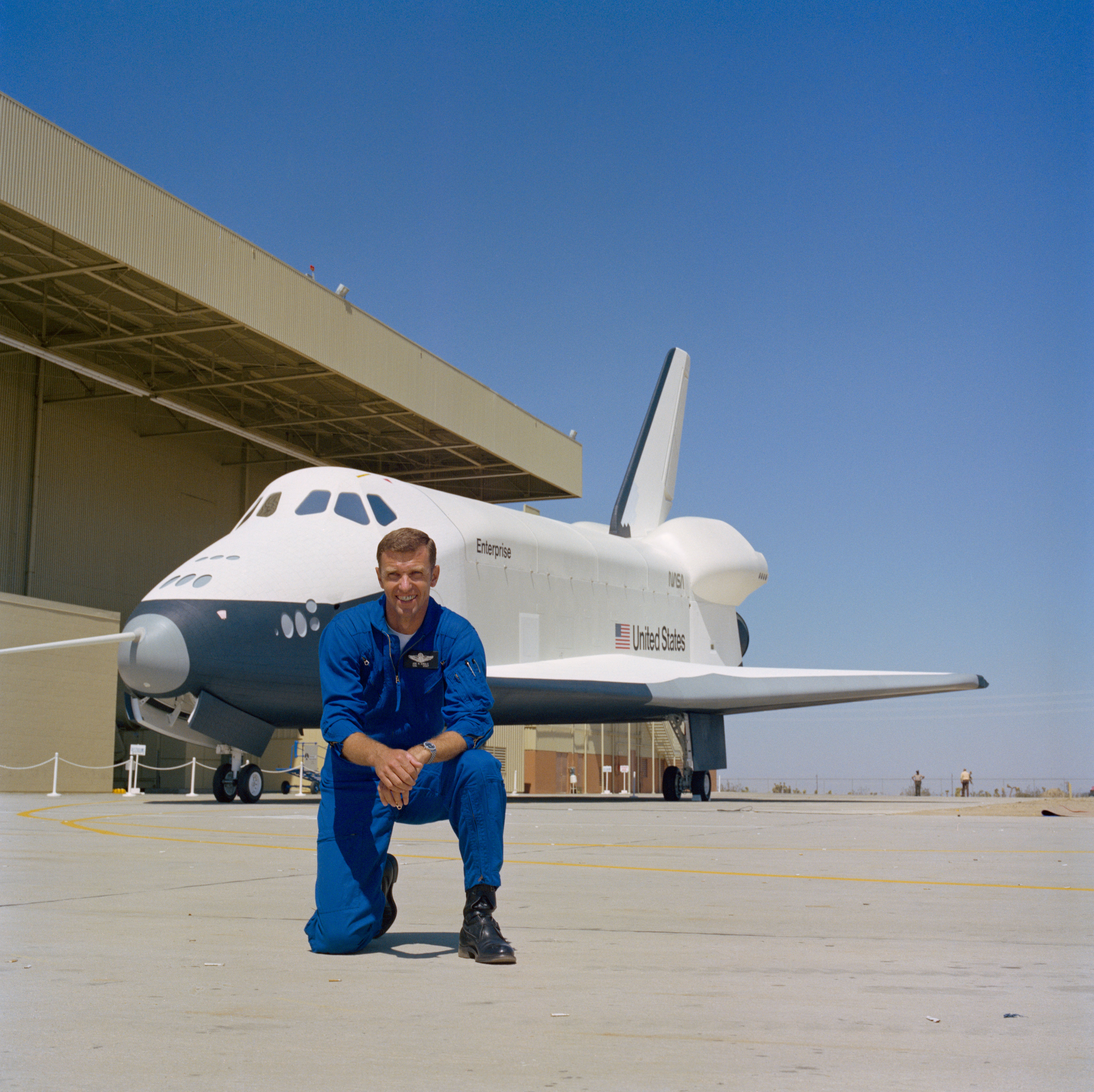 NASA astronaut Engle poses in front of space shuttle Enterprise during its first rollout in 1976