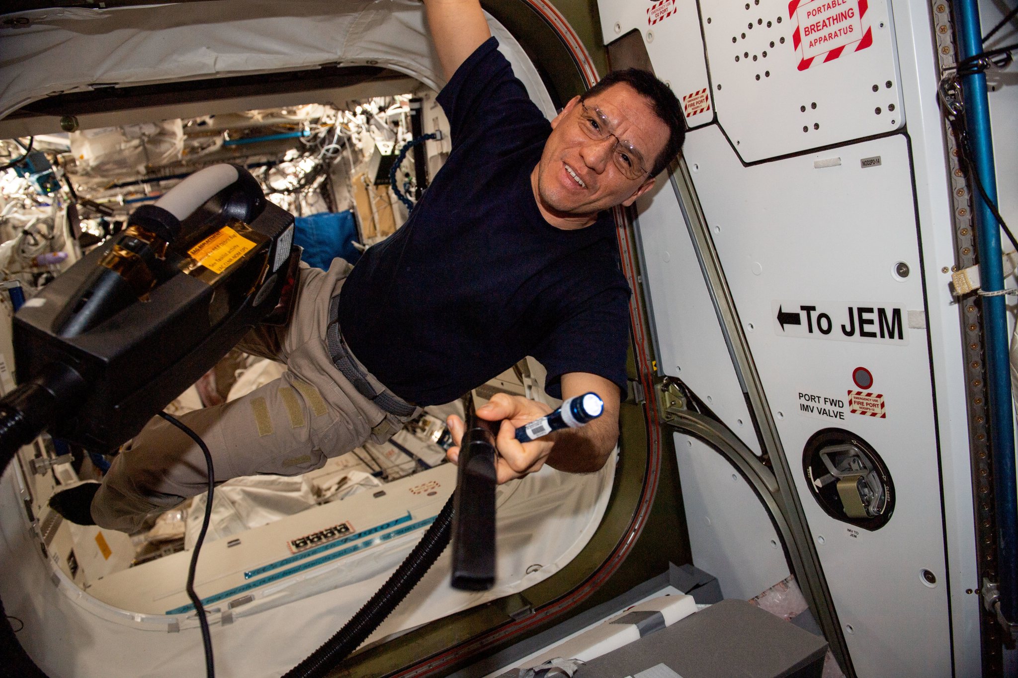 NASA astronaut and Expedition 68 Flight Engineer Frank Rubio is pictured conducting maintenance tasks inside the International Space Station's Harmony module.