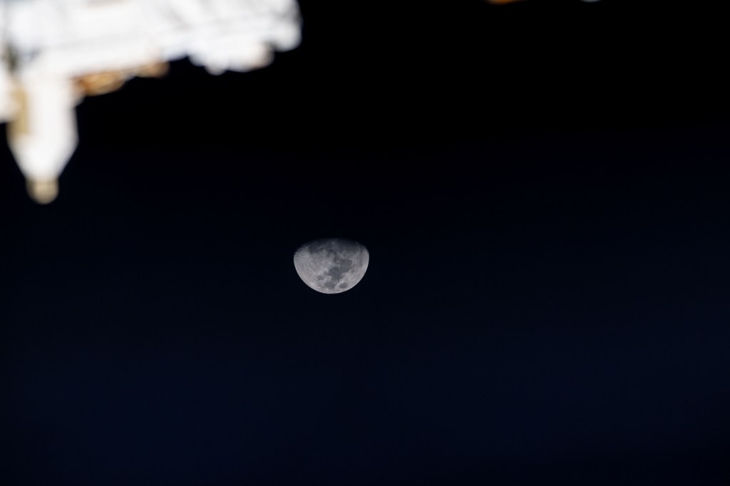 iss070e008966 (Oct. 24, 2023) -- The Moon reaches third quarter phase surrounded by the black of space as the International Space Station orbited 260 miles above the Indian Ocean.
