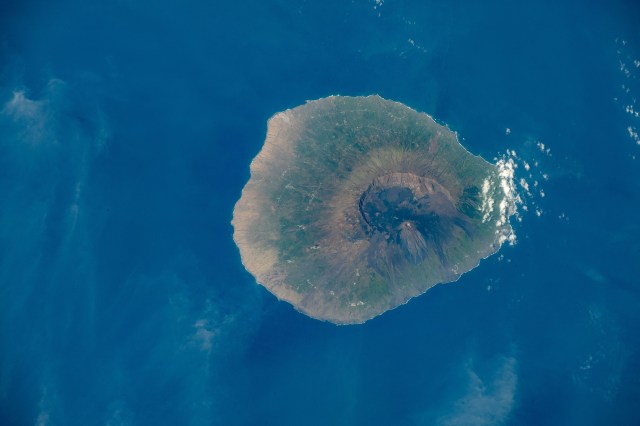 iss070e014352 (Oct. 27, 2023) -- Roughly 500 miles (~800 km) off the western coast of Africa lies the Cape Verde island country. One of the southernmost islands in the group is Fogo, home to Pico do Fogo (to the right of the island), an active stratovolcano. This photograph was taken as the International Space Station soared 260 miles above.