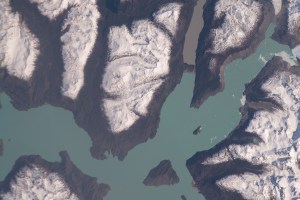 iss070e021230 (Oct. 31, 2023) -- Lago O'Higgins, or San Martin Lake, flows between snow-capped mountain ranges in Chile as the International Space Station soared nearly 270 miles above.