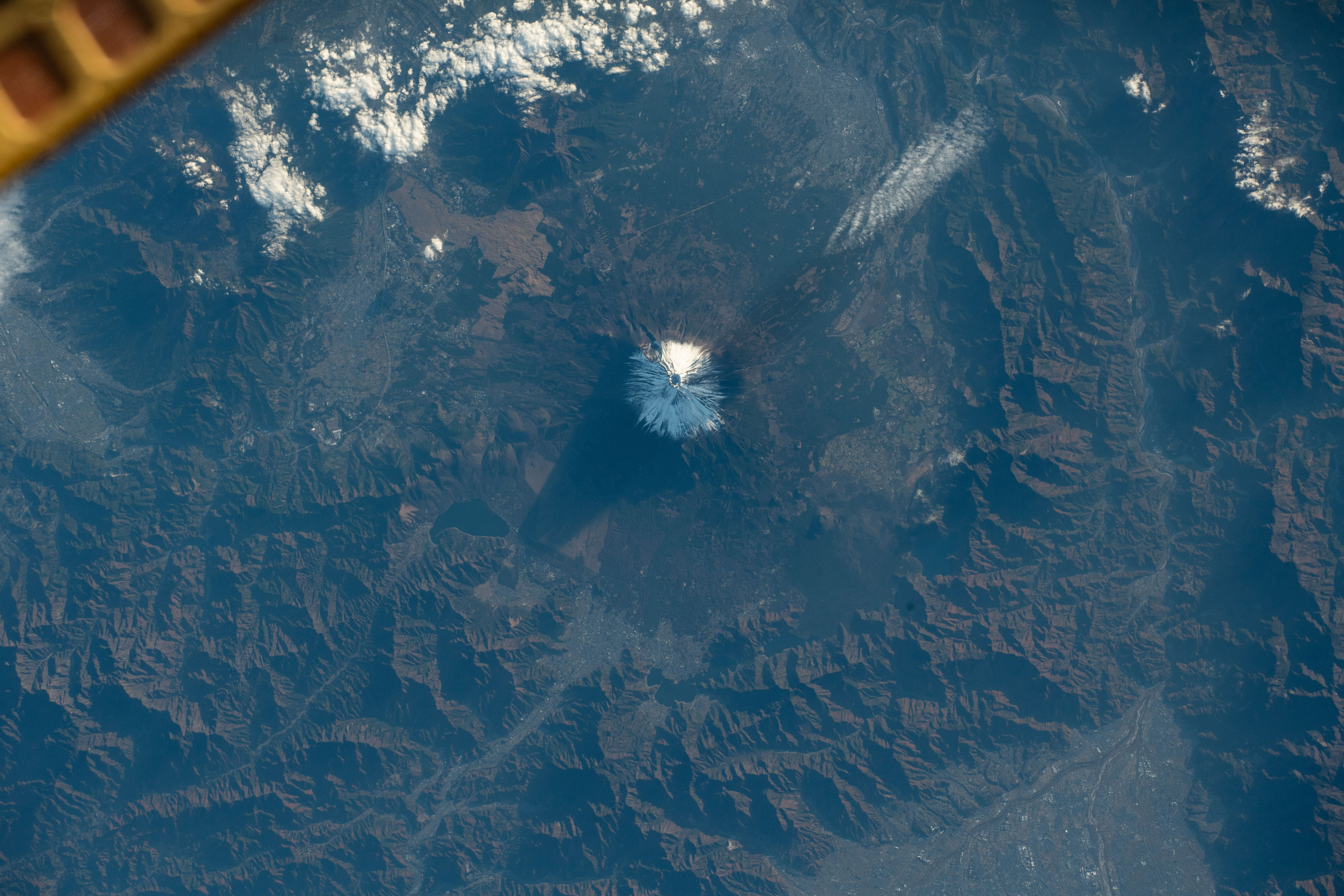 iss070e029669 (Nov. 23, 2023) -- The tallest mountain in Japan, Mount Fuji, was pictured as the International Space Station orbited 260 miles above. The summit of the active stratovolcano spends five months out of the year covered in snow, reaching over 12,000 feet (~3,700 meters) in elevation.