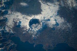 iss070e029717 (Nov. 23, 2023) -- In the caldera of Nemrut, a dormant volcano in Turkey, is Lake Nemrut. Fed by hot springs, the freshwater lake sits at an elevation of roughly 7,300 feet (~2,200 meters). Near the bottom of the image is the alkaline Lake Van, the largest in the country. The International Space Station orbited 260 miles above as this photograph was taken.