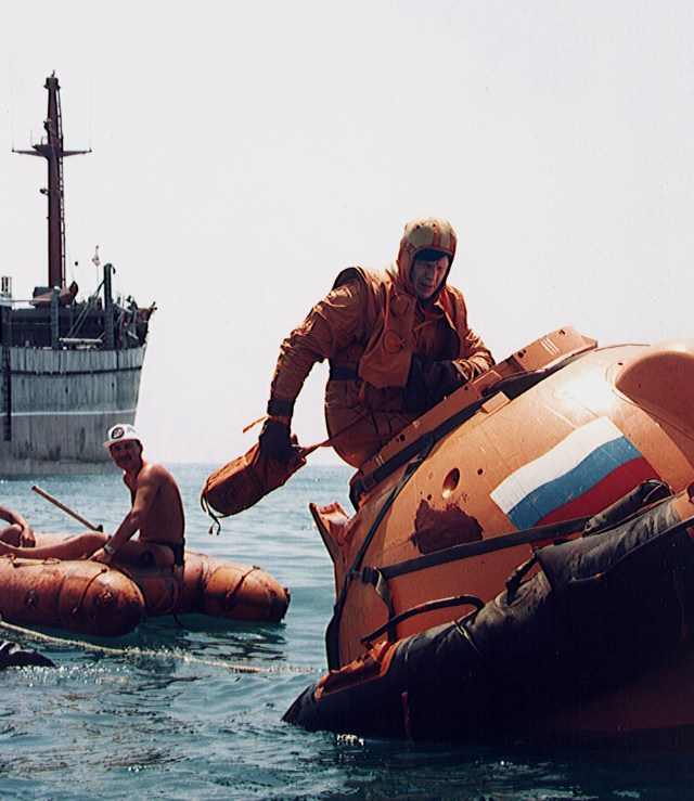 Astronaut Bill Shepherd, commander of the first International Space Station crew, prepares to plunge into the water from a mockup of a Russian Soyuz spacecraft descent module as he goes through water survival training in the Black Sea recently. Such training would be needed if the Russian Soyuz spacecraft were to land in the water instead of on land as is normal. Shepherd, along with crew members cosmonauts Yuri Gidzenko, the Soyuz commander, and Flight Engineer Sergei Krikalev, will launch on a Russian Soyuz spacecraft to the new station in January 1999. They will return on a U.S. Space Shuttle five months later, however, and the Soyuz spacecraft will remain attached to the station as a lifeboat.