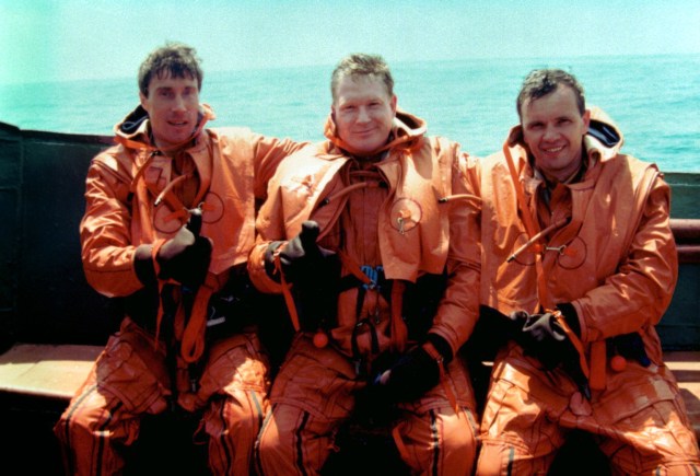 97-10687 (October 3, 1997) --- The first crew of the International Space Station pose aboard a Black Sea freighter following water survival training recently. From left, they are Flight Engineer and Russian Cosmonaut Sergei Krikalev; International Space Station Commander and U.S. Astronaut Bill Shepherd; and Soyuz Commander and Russian Cosmonaut Yuri Gidzenko.