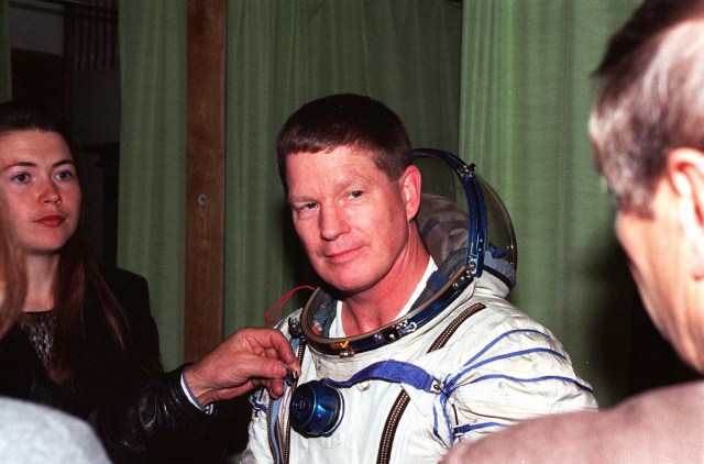 Astronaut Bill Shepherd, commander of the first crew of the International Space Station, dons a Russian pressure suit as part of his training recently at the Gagarin Cosmonaut Training Center, Russia. Shepherd, Soyuz Commander cosmonaut Yuri Gidzenko and Flight Engineer cosmonaut Sergei Krikalev will be launched aboard a Russian Soyuz spacecraft in late January 1999 to begin the first human habitation of the station. They will spend five months aboard the new station, and assist with assembly and checkout of systems onboard that will include three visiting Space Shuttles. During the crew's stay, the station will be outfitted with the first U.S. solar arrays, the U.S. laboratory module and the Canadian Space Station Remote Manipulator System mechanical arm. Shepherd's crew will begin a permanent human presence on the International Space Station. The crew began training for the mission in late 1996.