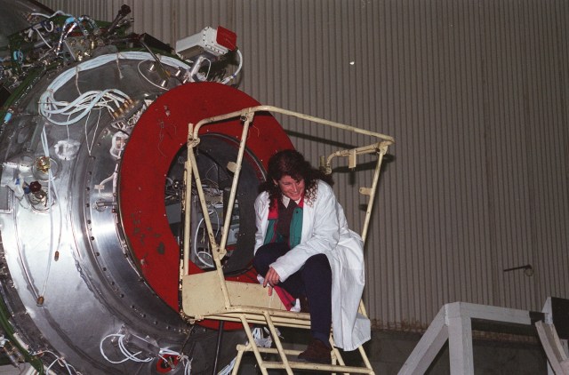 Astronaut Susan Helms, a member of the second crew scheduled to live aboard the International Space Station, inspects a test article for the Russian Service Module during a recent training visit to Moscow. The Service Module will be the main living quarters for astronauts onboard the International Space Station. Helms is scheduled to fly to the station in June 1999 with fellow crewmembers cosmonaut and Commander Yuri Usachev and astronaut Jim Voss.