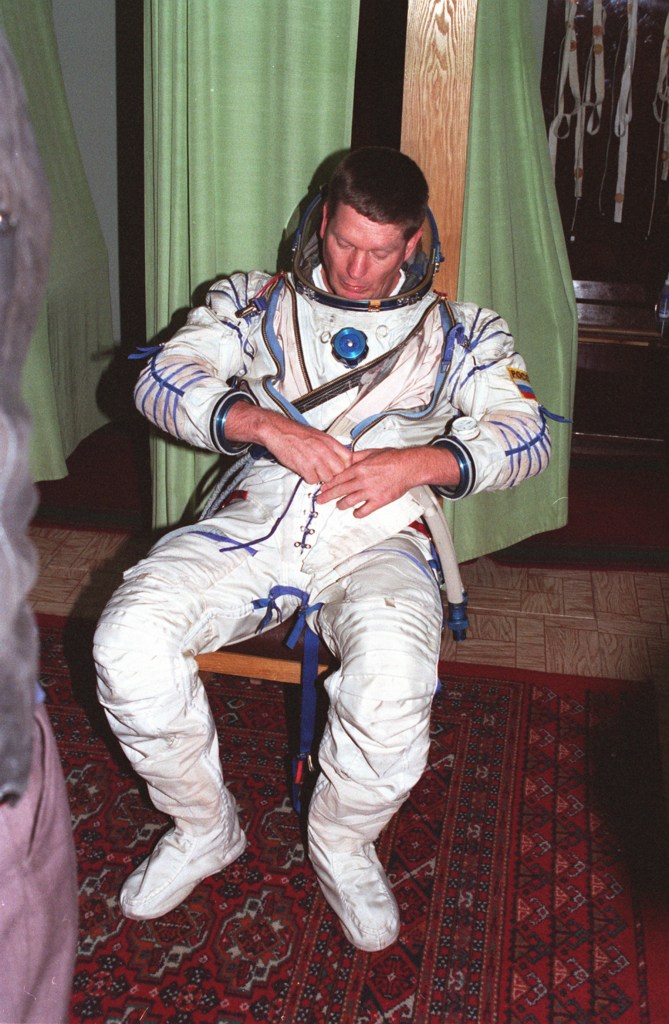 Astronaut Bill Shepherd, commander of the first crew of the International Space Station, dons a Russian pressure suit as part of his training recently at the Gagarin Cosmonaut Training Center in Star City, Russia. Shepherd, Soyuz Commander cosmonaut Yuri Gidzenko and Flight Engineer cosmonaut Sergei Krikalev will be launched aboard a Russian Soyuz spacecraft in late January 1999 to begin the first human habitation of the station. They will spend five months aboard the new station, and assist with assembly and checkout of systems onboard that will include three visiting Space Shuttles. During the crew's stay, the station will be outfitted with the first U.S. solar arrays, the U.S. laboratory module and the Canadian Space Station Remote Manipulator System mechanical arm. Shepherd's crew will begin a permanent human presence on the International Space Station. The crew began training for the mission in late 1996.