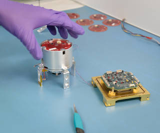 The centrifuges aboard the SporeSat spacecraft will literally fit into the palm of your hand.