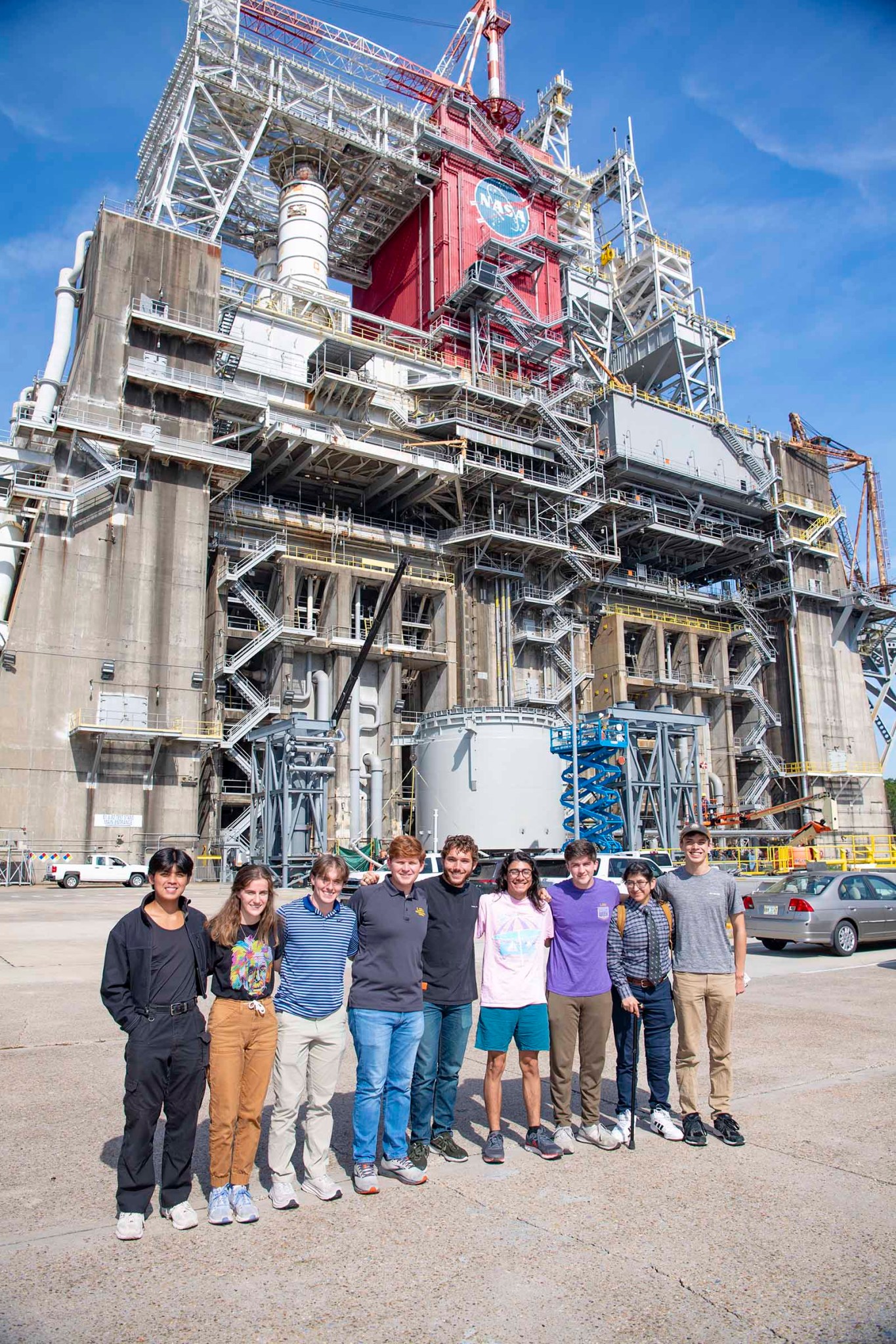 Members of the Louisiana State University branch of the American Institute of Aeronautics and Astronautics (AIAA) stand at the Thad Cochran Test Stand