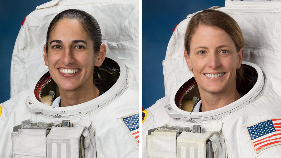 (From left) Astronauts Jasmin Moghbeli and Loral O'Hara pose for portraits in spacesuits at the Johnson Space Center in Houston, Texas.