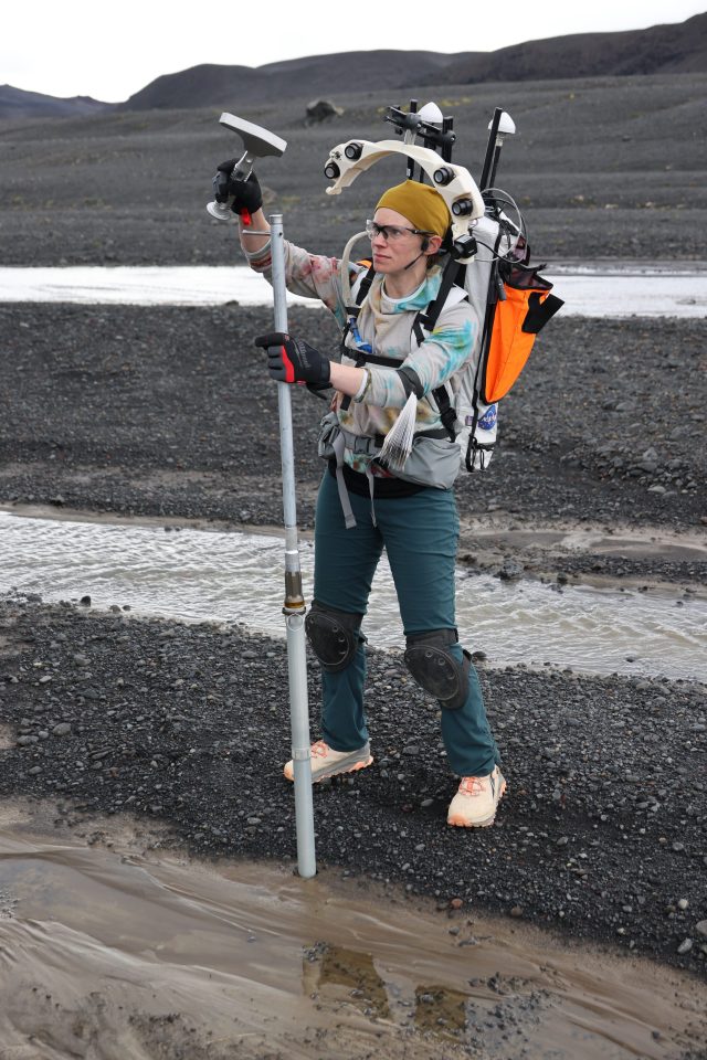 NASA astronaut Zena Cardman cores for geologic samples during a NASA analog mission in Iceland.
