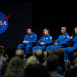 From left, Artemis II astronauts Jeremy Hansen, Christina Koch, and Victor Glover listen as Commander Reid Wiseman talks during an employee event at NASA’s Marshall Space Flight Center on Nov. 27.