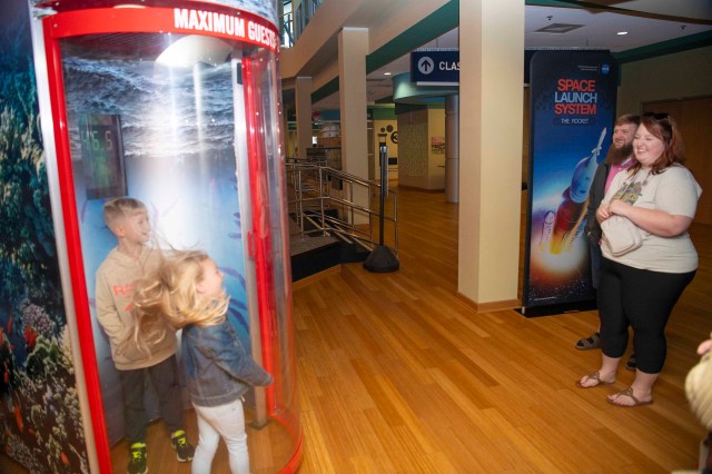 Young visitors enjoy the wind simulator at INFINITY Science Center.
