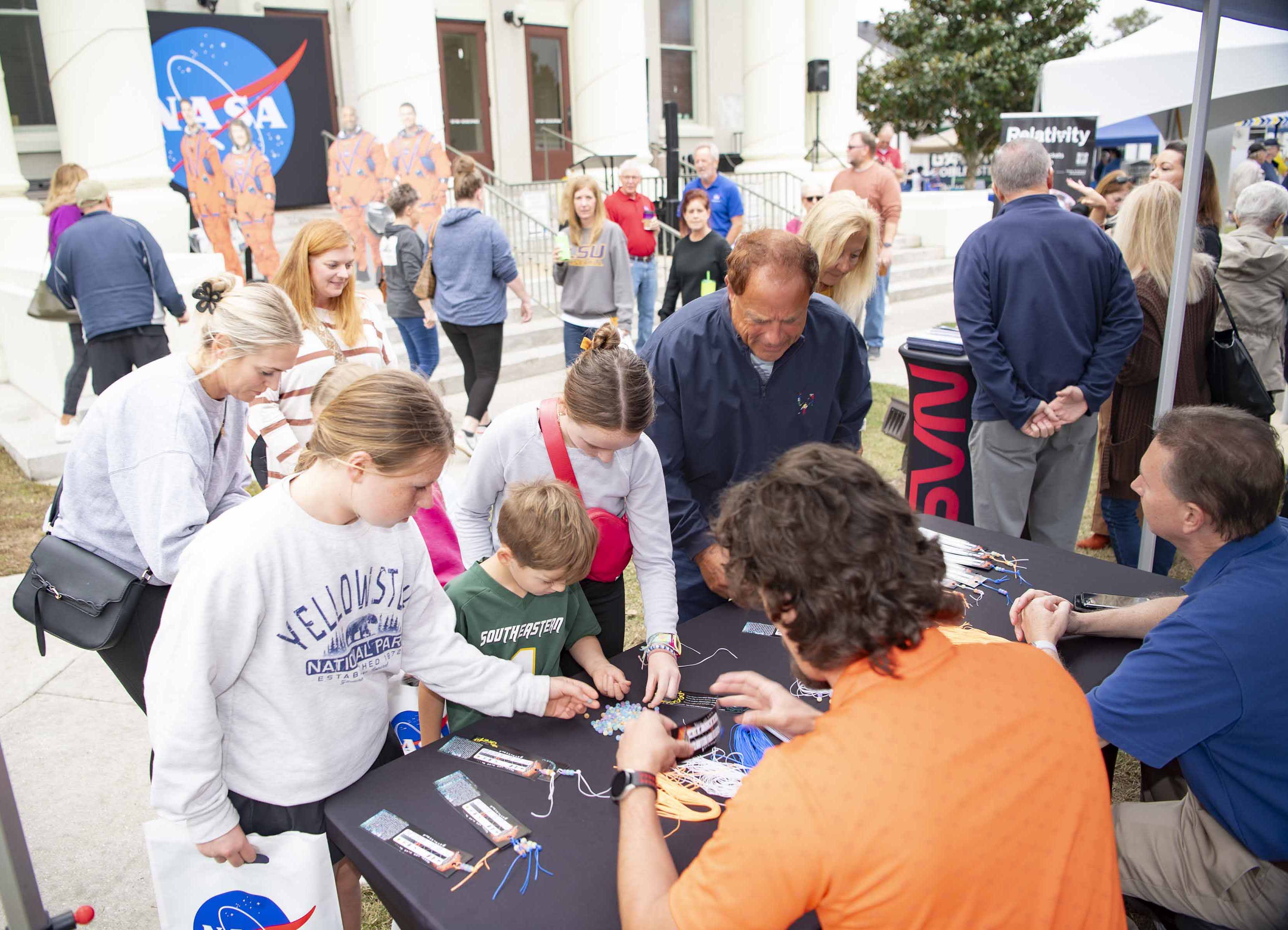 Families gathered at Stennis Day in the Bay to make bookmarks at one of the many featured booths.