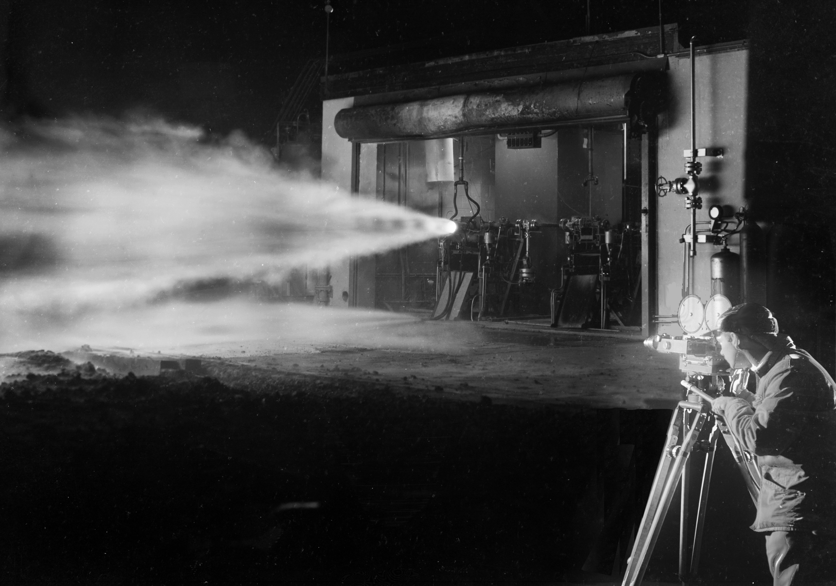 Photographer films engine firing at night.