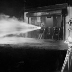 Photographer films engine firing at night.