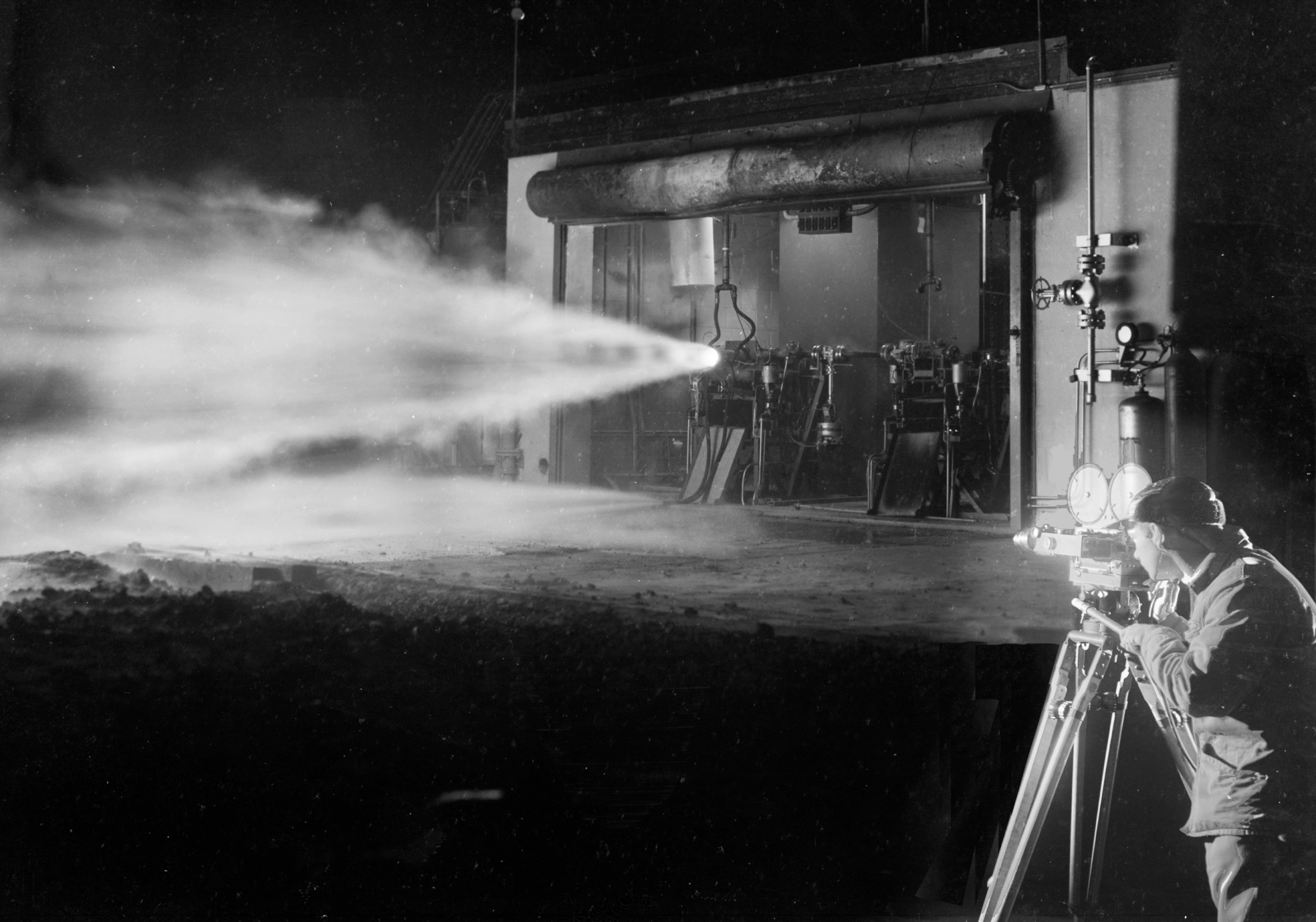 Photographer films engine firing at night.
