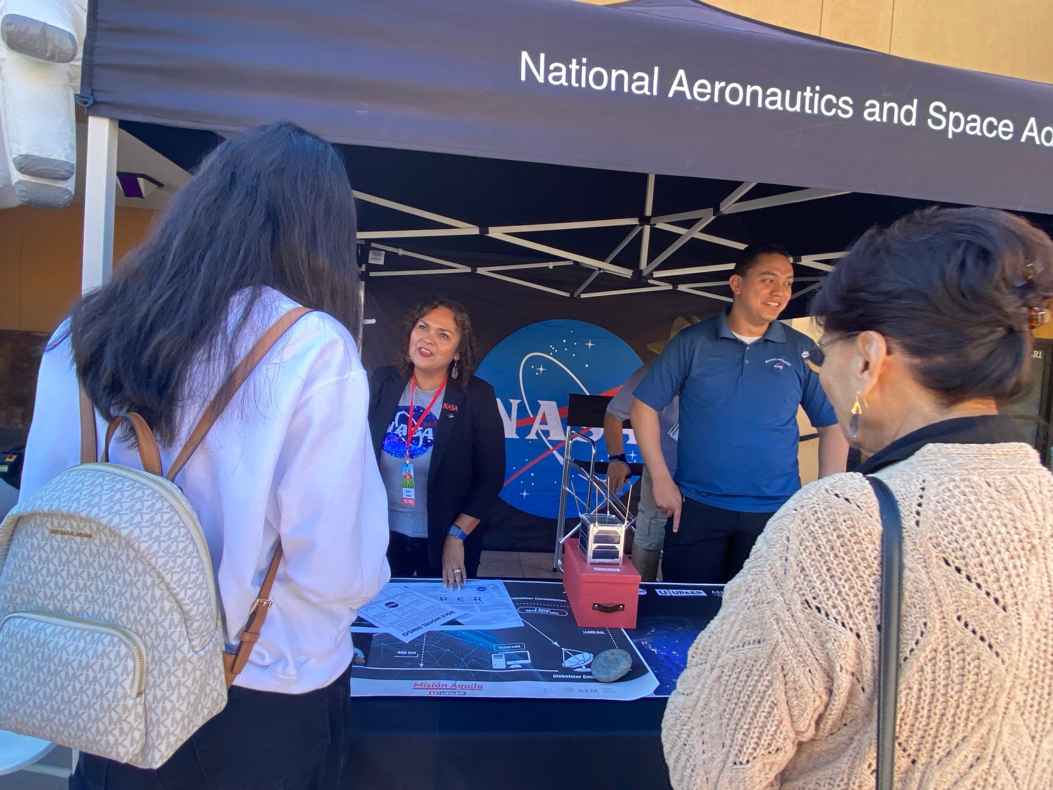 Carolina Rudisel and Andres Garcia Leyva connecting with the community at the Mexican Heritage Plaza event on