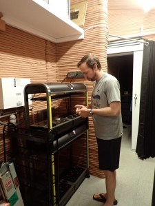 Medical Officer, Nathan Jones, preps the crop growth station inside the CHAPEA habitat.