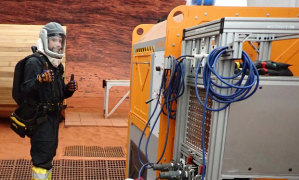 Medical Officer, Nathan Jones, suits up for a simulated Mars EVA.