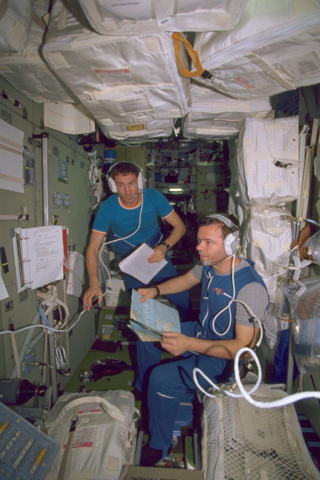 Early film documentation of the Expedition 1 crew members onboard the International Space Station (ISS) shows cosmonauts Sergei K. Krikalev (left) and Yuri P. Gidzenko at work in the Zvezda Service Module. Krikalev, flight engineer, and Gidzenko, Soyuz commander, represent the Russian Aviation and Space Agency. This is one of the first film images released from the Expedition 1 crew.
