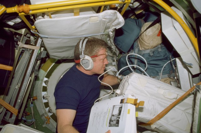 Astronaut William M. Shepherd, Expedition 1 mission commander, is pictured in a docking compartment aboard the International Space Station (ISS). This picture was taken with a 35mm camera about three days prior to the in-space reunion between the shuttle and station astronauts and cosmonauts.