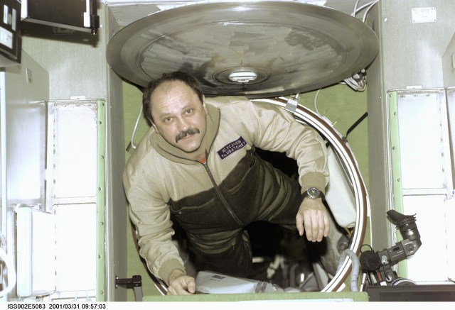 Cosmonaut Yury V. Usachev, Expedition Two commander, floats into the Zvezda Service Module onboard the International Space Station (ISS). Usachev, representing Rosaviakosmos, and two American astronauts recently replaced the Expedition One crew on the orbital outpost after that threesome had been onboard since early November 2000. The image was recorded with digital still camera.