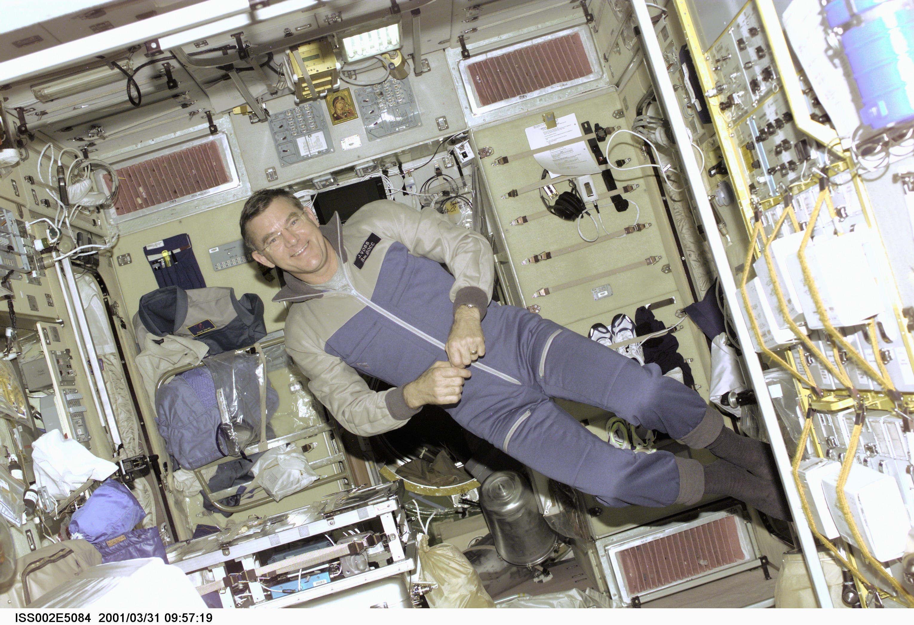 Astronaut James S. Voss, Expedition Two flight engineer, floats in the Zvezda Service Module onboard the International Space Station (ISS). Voss, along with astronaut Susan J. Helms and cosmonaut Yury V. Usachev of Rosaviakosmos, recently replaced the initial three-member crew onboard the orbital outpost. The image was taken with a digital still camera.