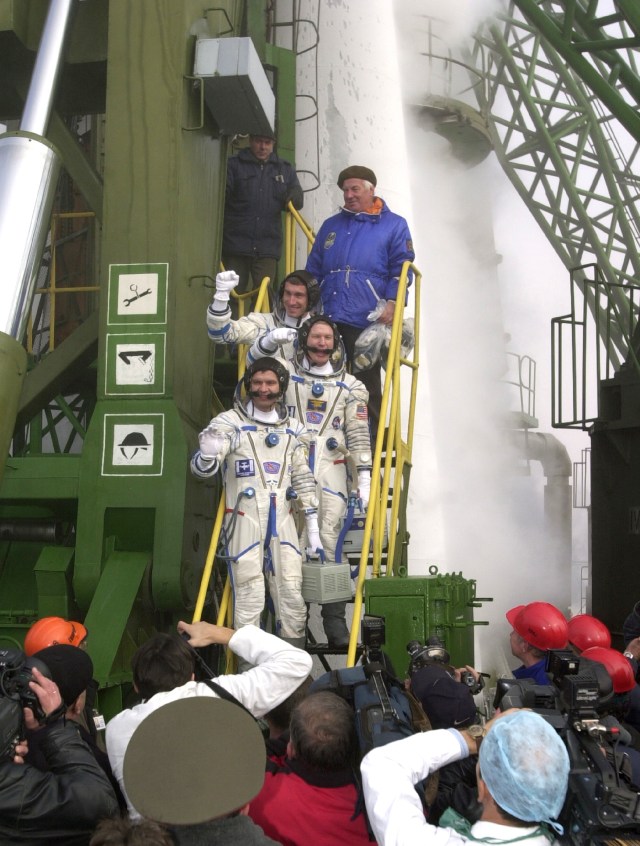 The Expedition 1 crew members pose for final photos prior to their launch aboard a Soyuz vehicle from the Baikonur Cosmodrome in Kazakhstan. Expedition 1 commander William M. (Bill) Shepherd (center crewmember on steps) is flanked by Soyuz commander Yuri P. Gidzenko (bottom) and Sergei K. Krikalev, flight engineer.