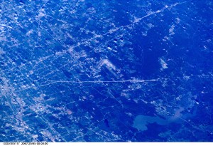 This westerly-looking view over north Harris County featuring Lake Houston and the Bush Intercontinental Airport was photographed with a digital still camera from the Earth-orbiting International Space Station (ISS). Parts of the 610 Loop, Interstate Highway 45, U.S. Highway 59 and the Sam Houston Toll Way can be easily delineated in the view. Part of the downtown area is just below center at left edge of the frame.