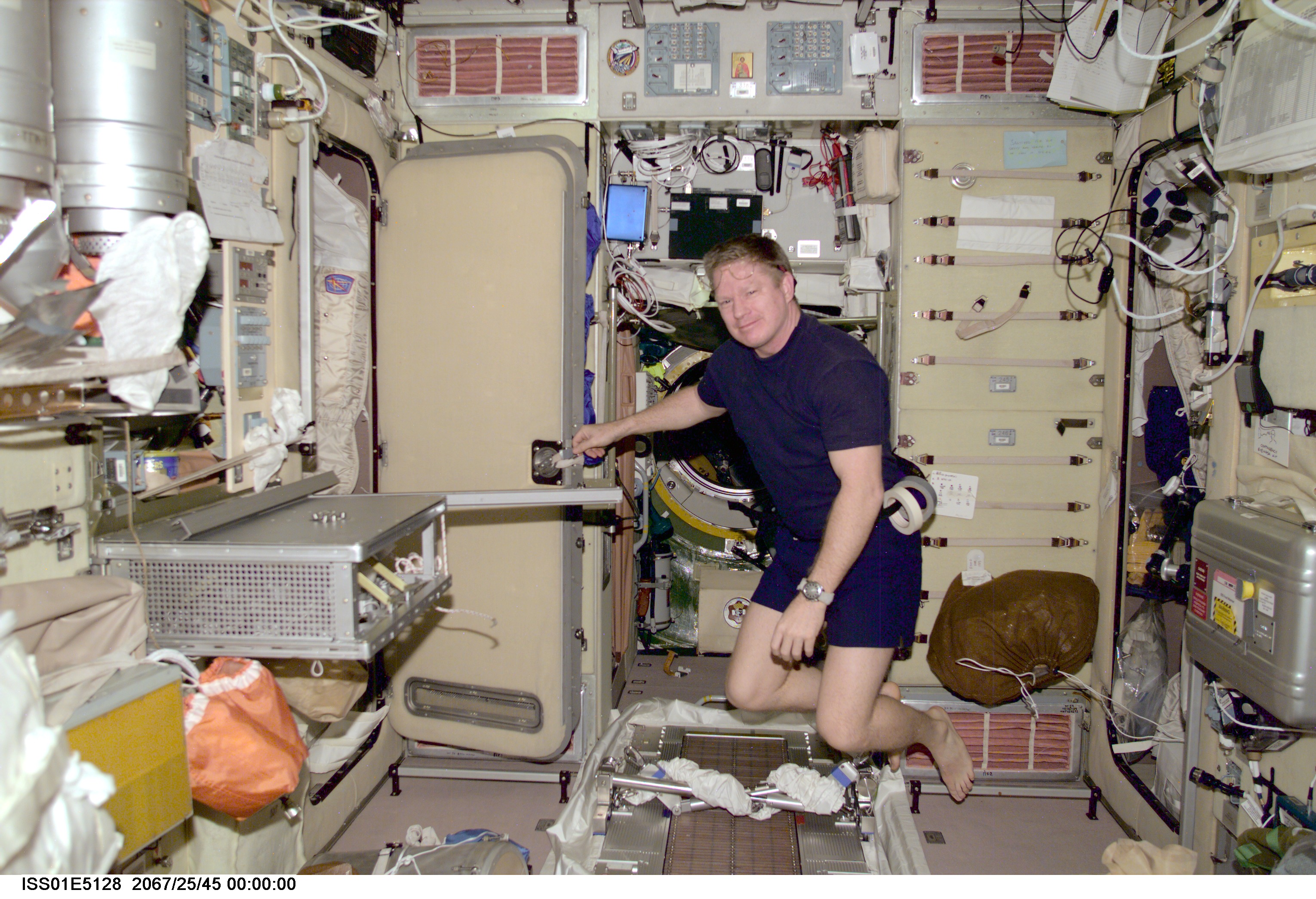 Astronaut William M. Shepherd, commander for the Expedition One mission, floats in the microgravity, shirt-sleeve environment of the International Space Station's Zvezda Service Module. Shepherd was taking a brief break from work to install various furnishings for the SM. The image was taken with a digital still camera and down linked from the station to ground controllers in Houston.