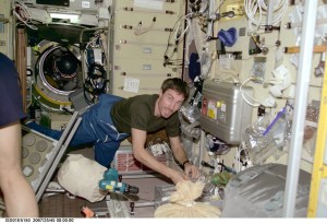 Cosmonaut Sergei K. Krikalev, Expedition One flight engineer, retrieves a tool during an installation and set-up session in the Zvezda service module aboard the International Space Station (ISS). The picture was recorded with a digital still camera.