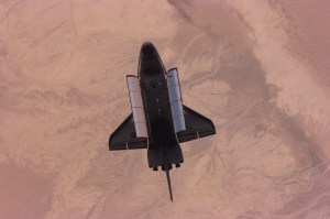This nadir image of the Space Shuttle Atlantis backdropped over a desert was photographed by the three-man Expedition One crew aboard the International Space Station (ISS) shortly after the shuttle and the outpost unlinked following several days of joint operations of the two crews. The scene was recorded with a digital still camera.