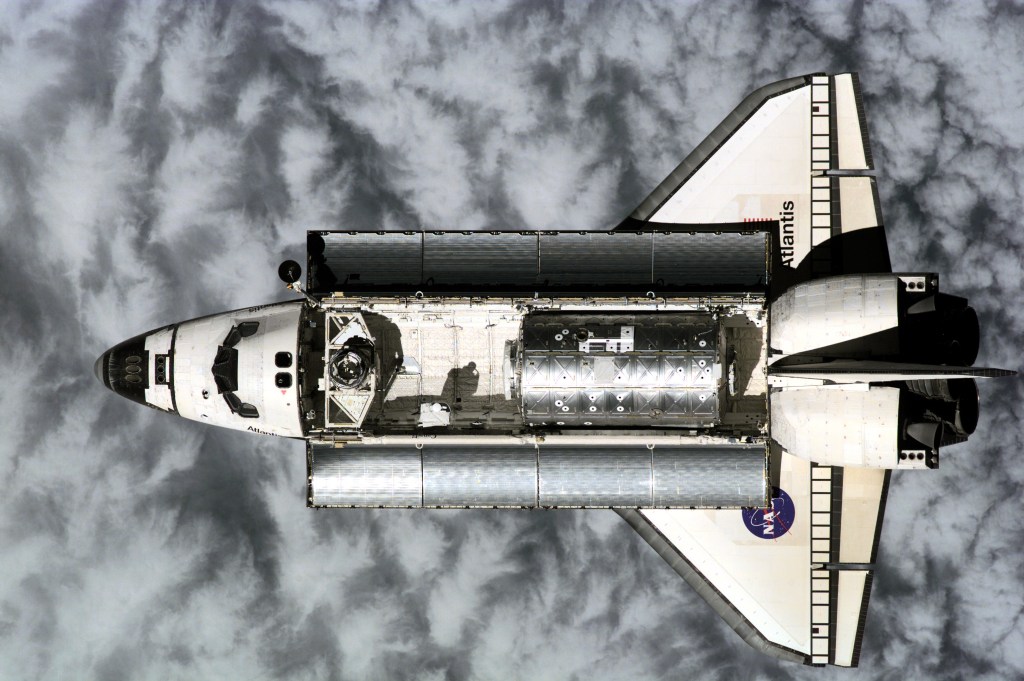 Atlantis was photographed from the International Space Station (ISS) prior to link-up with international outpost at 10:50 a.m. (CST), Feb. 9, 2001, as the two craft flew over the Western Pacific northeast of New Guinea. About ninety minutes later, hatches were swung open between Atlantis and the ISS, enabling the two crews to greet each other and transfer critical gear before re-closure later in preparation for the first (Feb. 10) of three planned space walks to help in the installation and hookup of Destiny on the Station. The photograph was taken with a digital still camera.