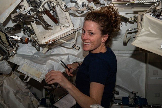 NASA astronaut and Expedition 70 Flight Engineer Loral O'Hara configures spacewalking tools inside the International Space Station's Quest airlock.