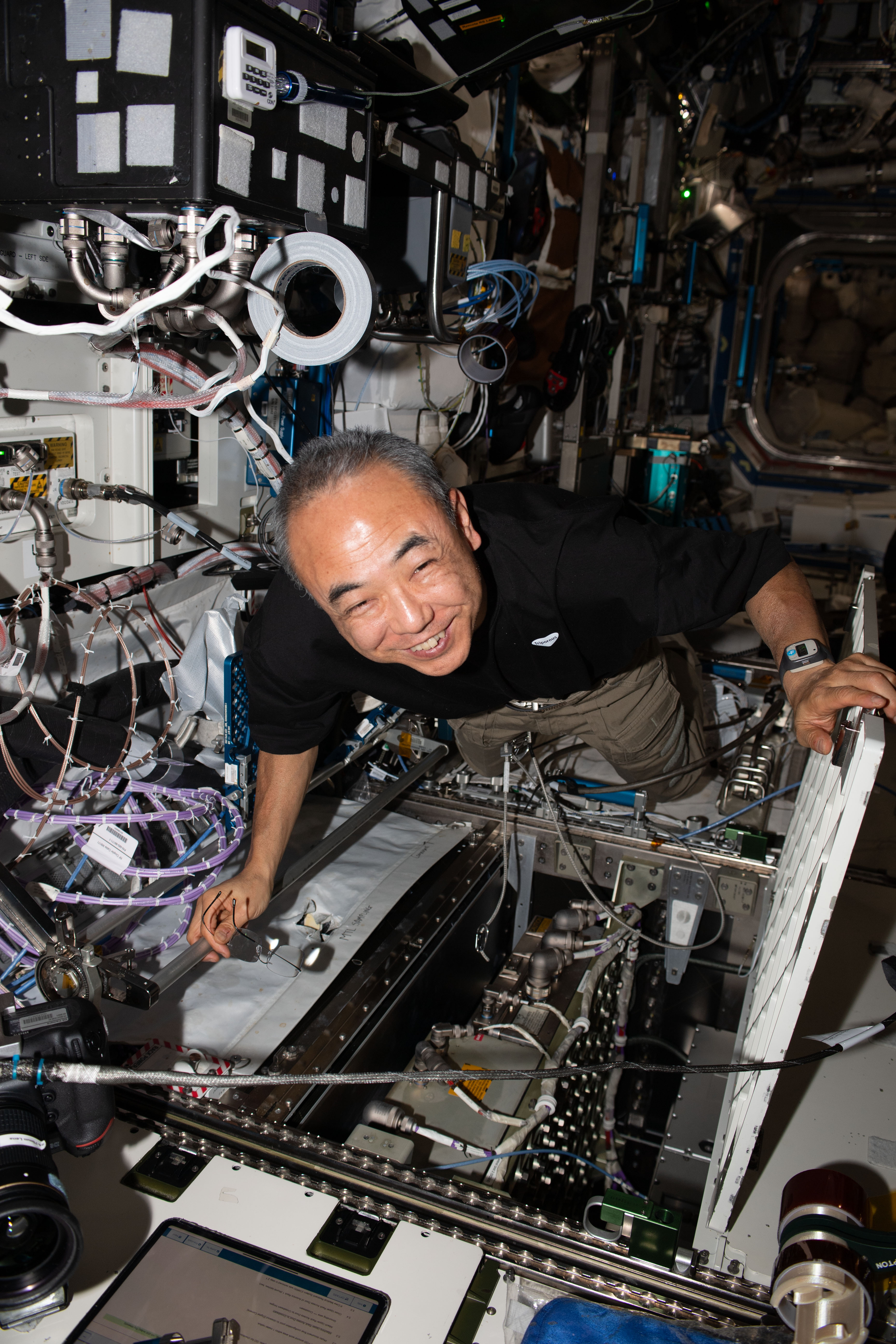 JAXA (Japan Aerospace Exploration Agency) astronaut and Expedition 70 Flight Engineer Satoshi Furukawa replaces hardware inside an avionics rack located aboard the International Space Station's Destiny laboratory module.