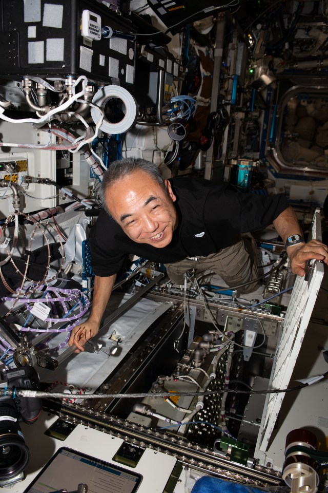 JAXA (Japan Aerospace Exploration Agency) astronaut and Expedition 70 Flight Engineer Satoshi Furukawa replaces hardware inside an avionics rack located aboard the International Space Station's Destiny laboratory module.