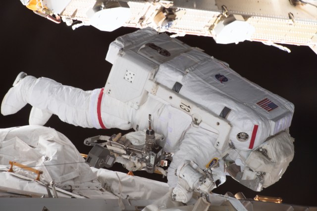 NASA astronaut and Expedition 70 Flight Engineer Jasmin Moghbeli is pictured tethered to the International Space Station during a spacewalk to replace one of the 12 trundle bearing assemblies on the port solar alpha rotary joint, which allows the arrays to track the Sun and generate electricity to power the station.