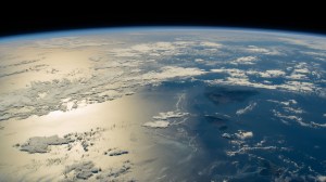 The sun's glint beams across the Pacific Ocean in this photograph from the International Space Station as it orbited 259 miles above the Hawaiian island chain.