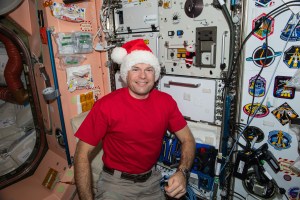 ESA (European Space Agency) astronaut and Expedition 70 Commander Andreas Mogensen gets ready for the Christmas season and poses for a fun portrait wearing a Santa Claus hat.